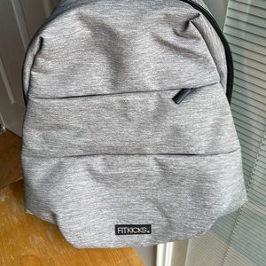 FitKicks sling bag, NWOT backpack, with 7 inch padded tablet pocket